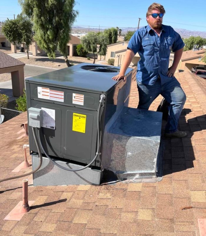 HVAC technician with Rooftop AC unit