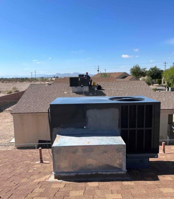 AC Unit on Rooftop With Technician