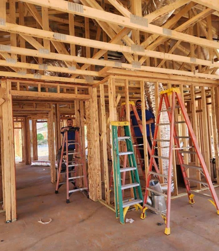 HVAC techs installing ductwork